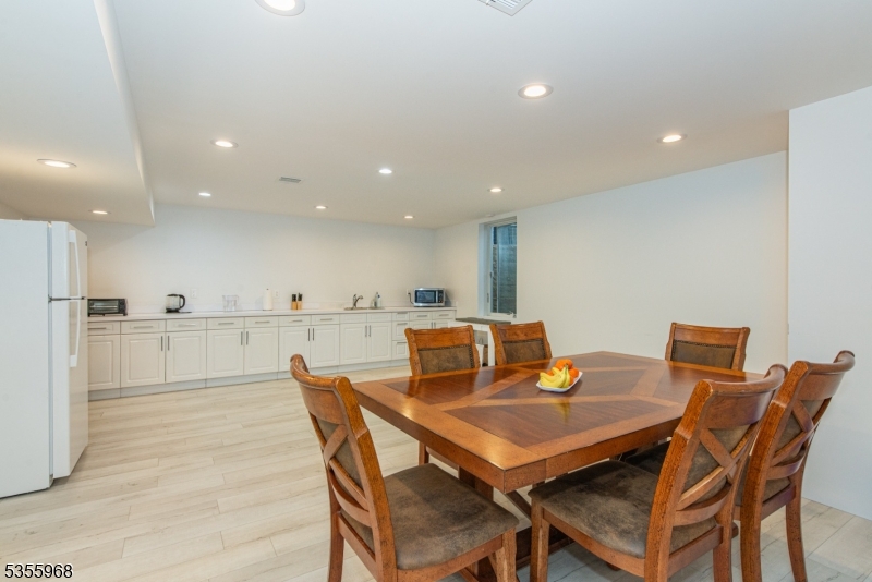 34 West Shore Road Mountain Lakes, NJ 07046 - Photo 32 of 43 a view of a dining room with furniture and wooden floor