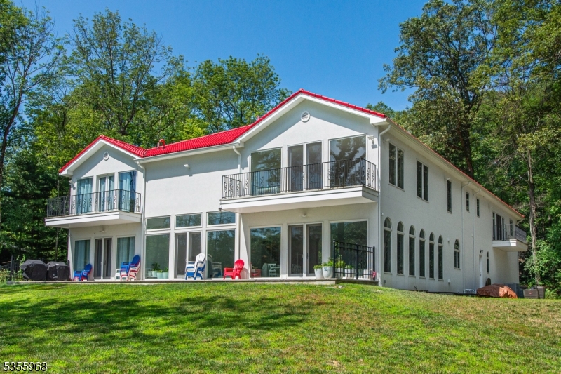 34 West Shore Road Mountain Lakes, NJ 07046 - Photo 35 of 43 a front view of a house with a yard