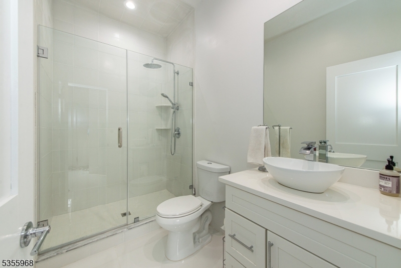 34 West Shore Road Mountain Lakes, NJ 07046 - Photo 38 of 50 a bathroom with a sink a toilet and shower