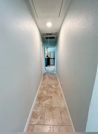 wooden floor in a hall with an entryway
