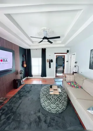 a living room with furniture rug and window
