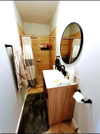 a bathroom with a sink and mirror