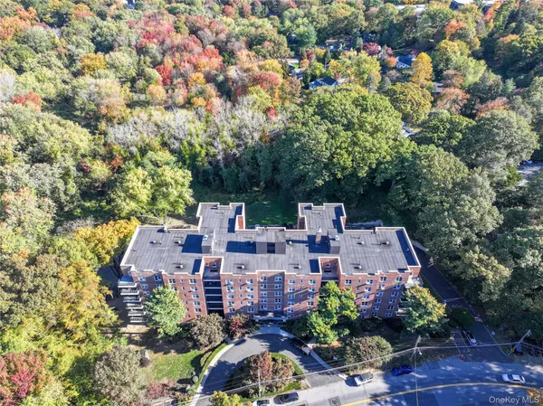 an aerial view of a house with lots of trees