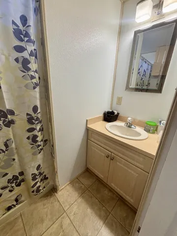 a bathroom with a sink and mirror
