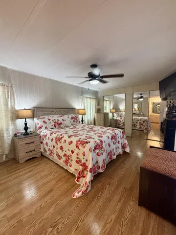 a bedroom with a large bed and a couch