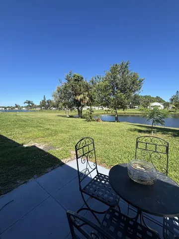 a view of a swimming pool and lounge chairs