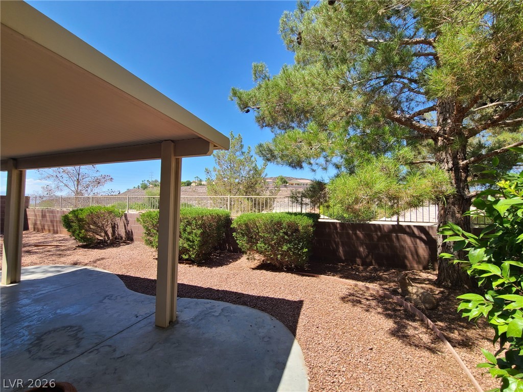 2278 Chestnut Ranch Avenue Henderson, NV 89052 - Photo 16 of 18 A spacious covered patio offers a refreshing outdoor retreat with views of distant hills.