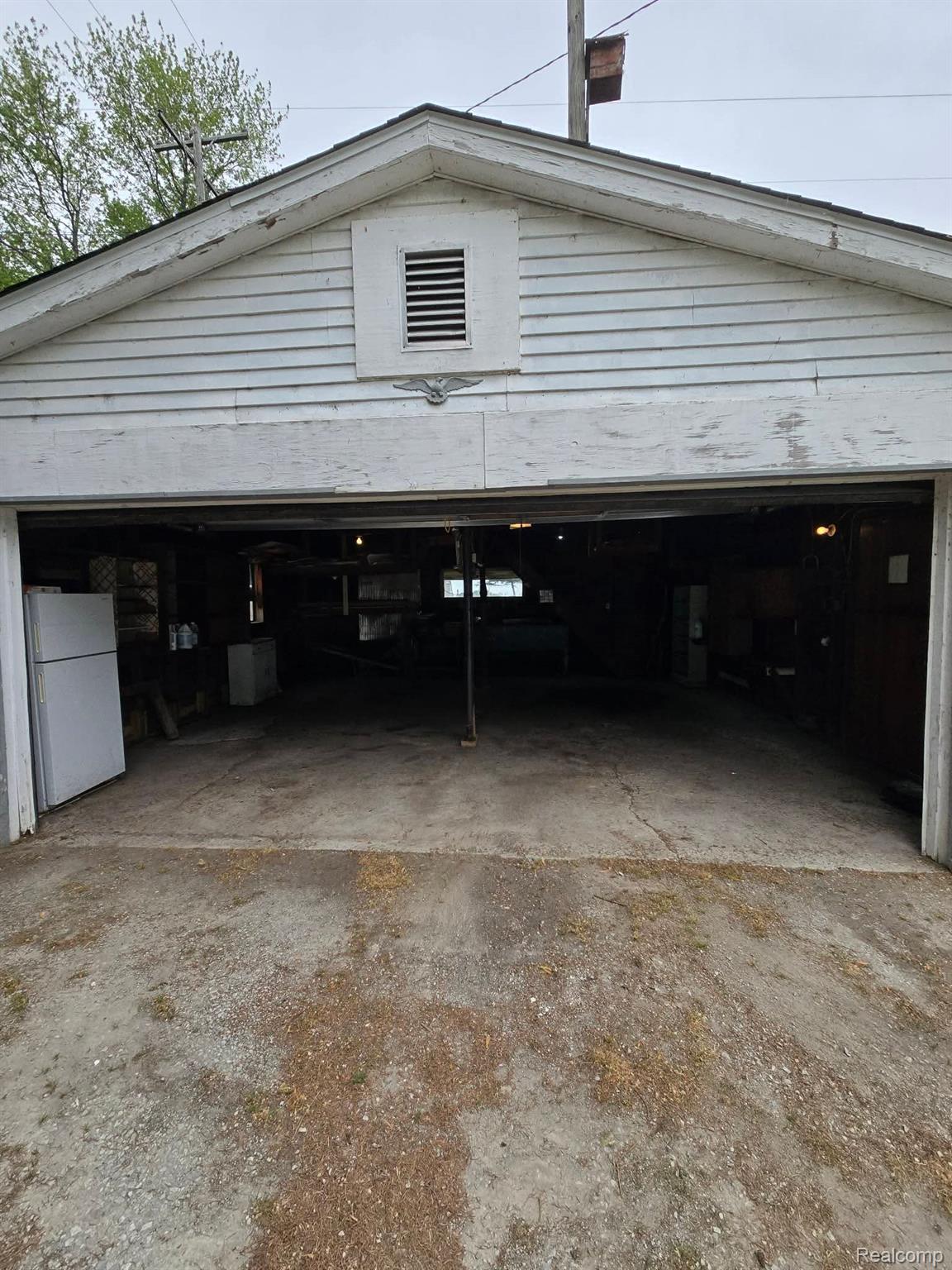 7974 West Gilford Road Reese, MI 48757 - Photo 34 of 36 Garage with freestanding refrigerator