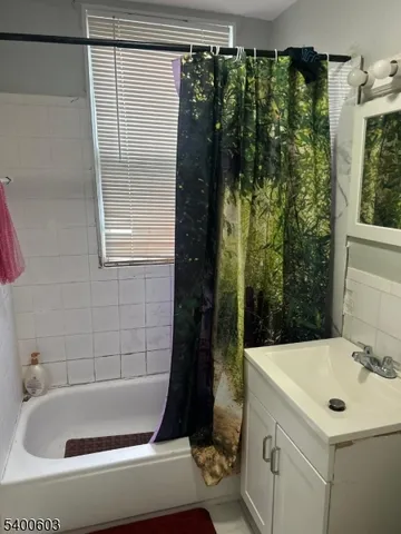 a bathroom with a sink and a shower