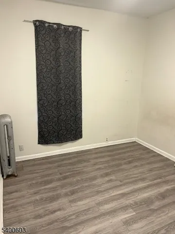 a view of wooden floor in an empty room