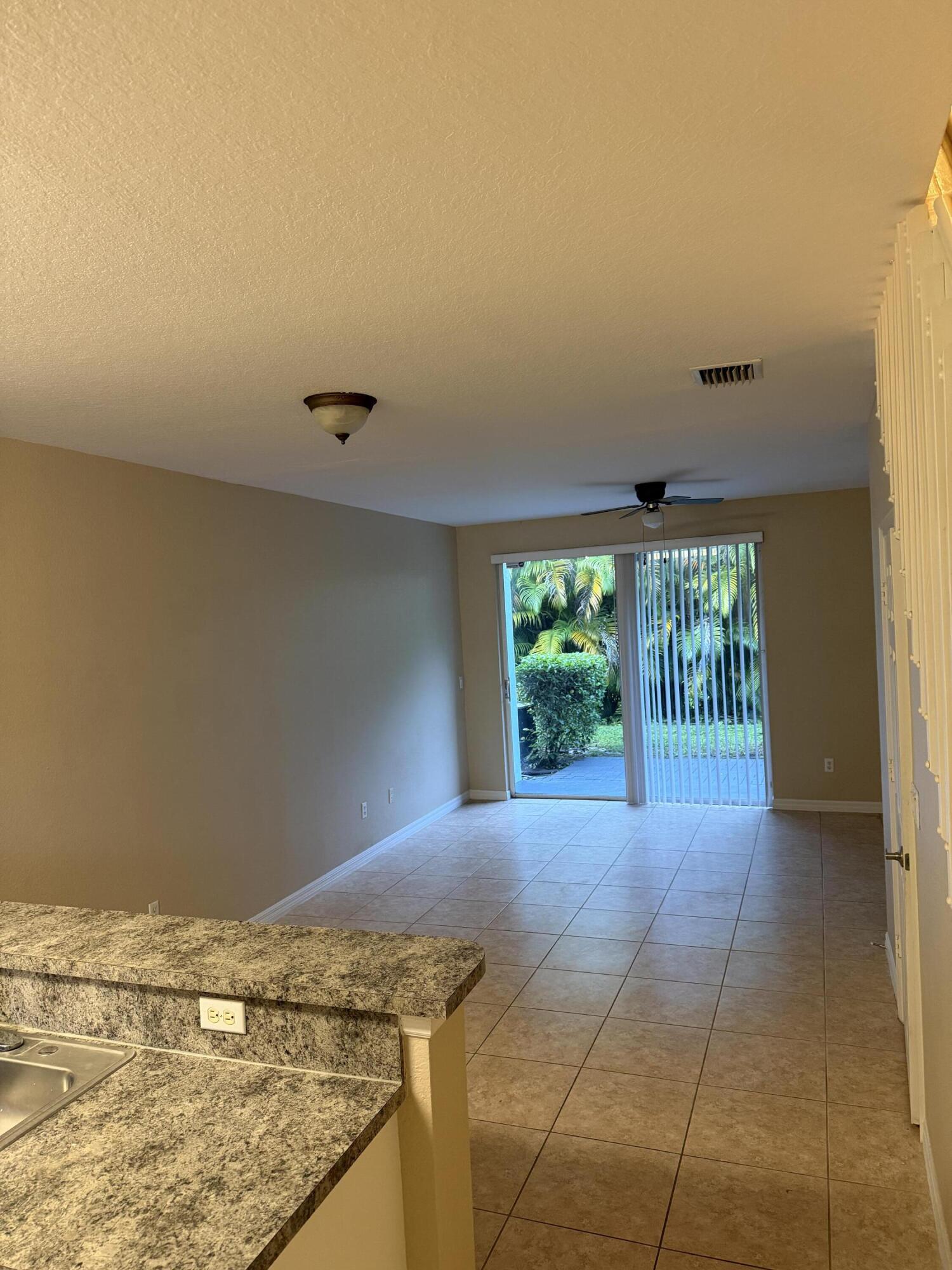 1992 Alamanda Way Riviera Beach, FL 33404 - Photo 10 of 13 a view of an empty room with a window