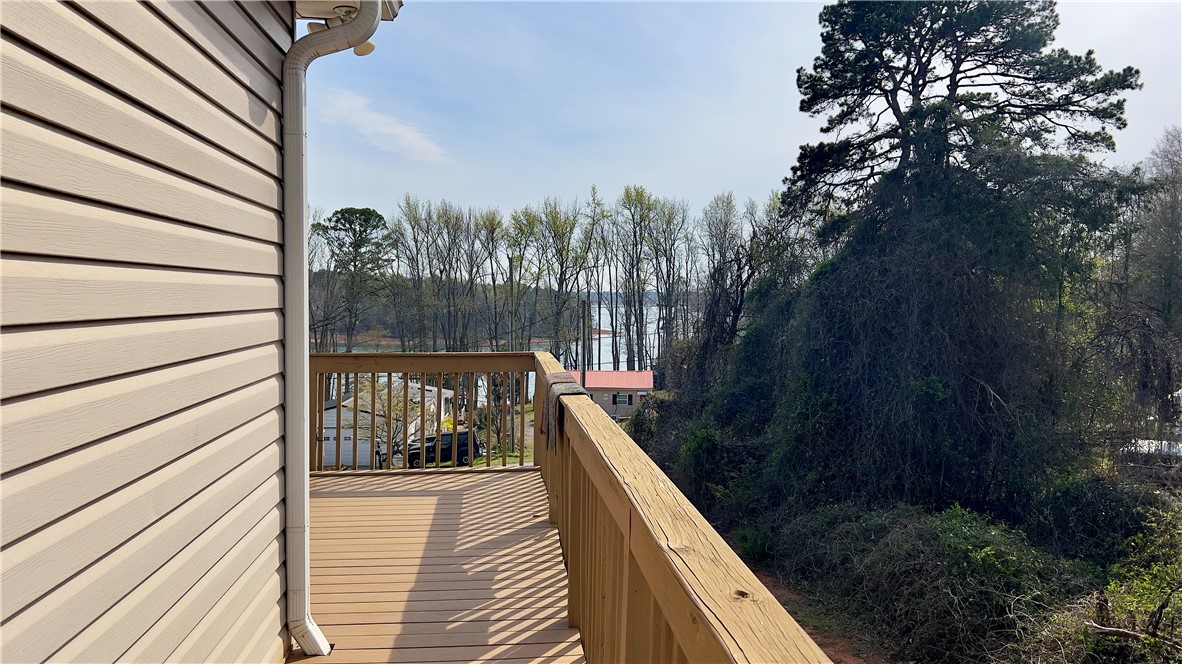 160 Hudgins Lake Road Townville, SC 29689 - Photo 37 of 41 A spacious wooden deck provides inspiring views of the tranquil lake and surrounding landscape.