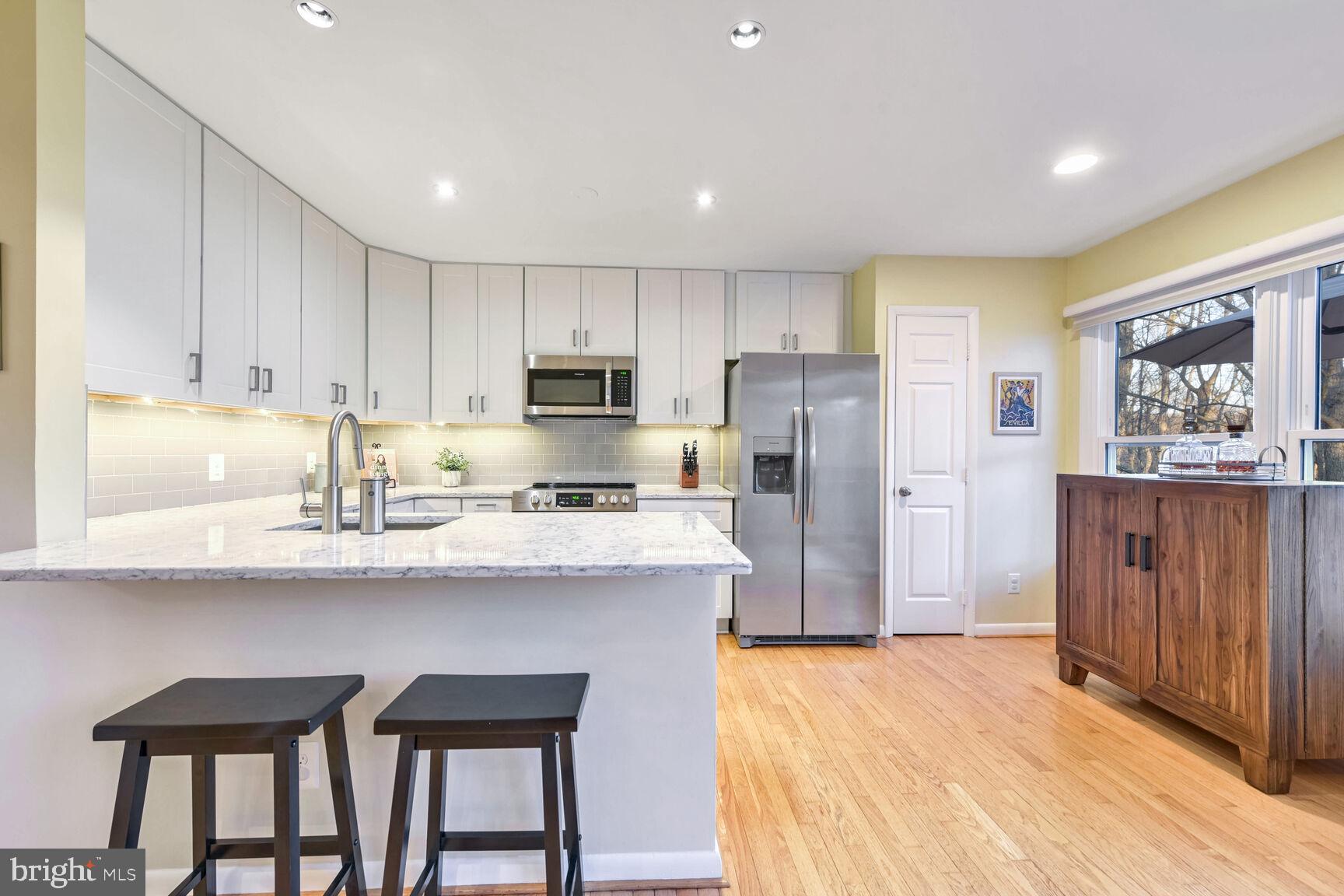 1642 Oak Spring Way Reston, VA 20190 - Photo 8 of 30 Remodeled Kitchen with Breakfast Bar