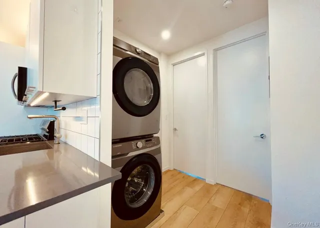 a view of a storage & utility room with a washer dryer