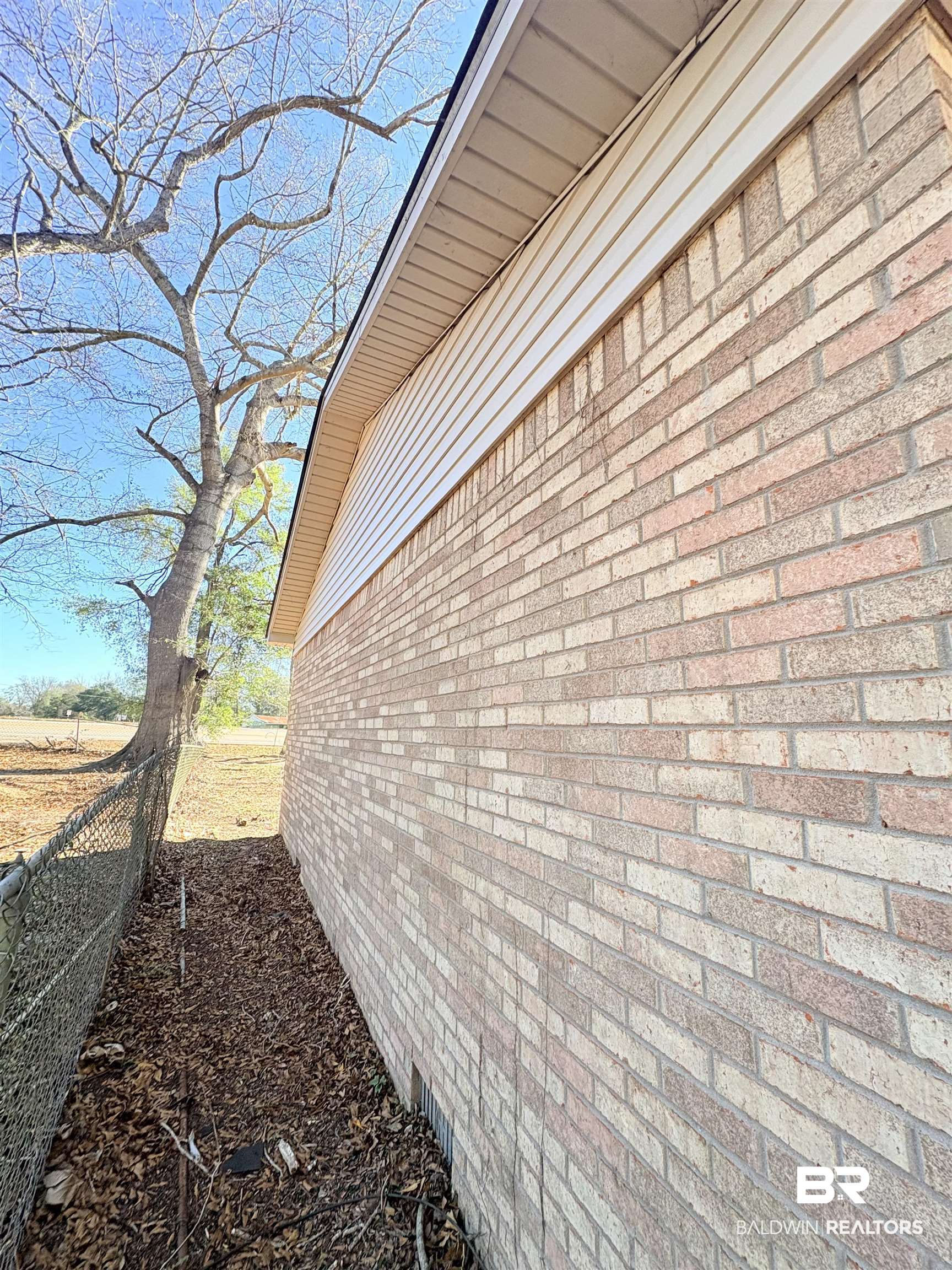 47 Fairview Street Evergreen, AL 36401 - Photo 12 of 15 View of property exterior featuring brick siding