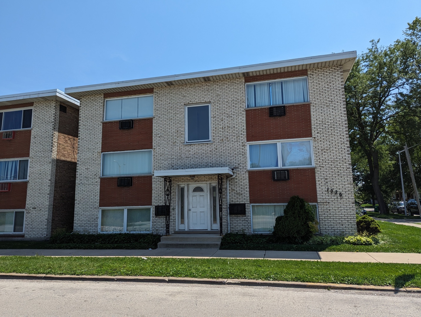 1526 Bataan Drive Broadview, IL 60155 - Photo 2 of 4 a front view of a house with a yard