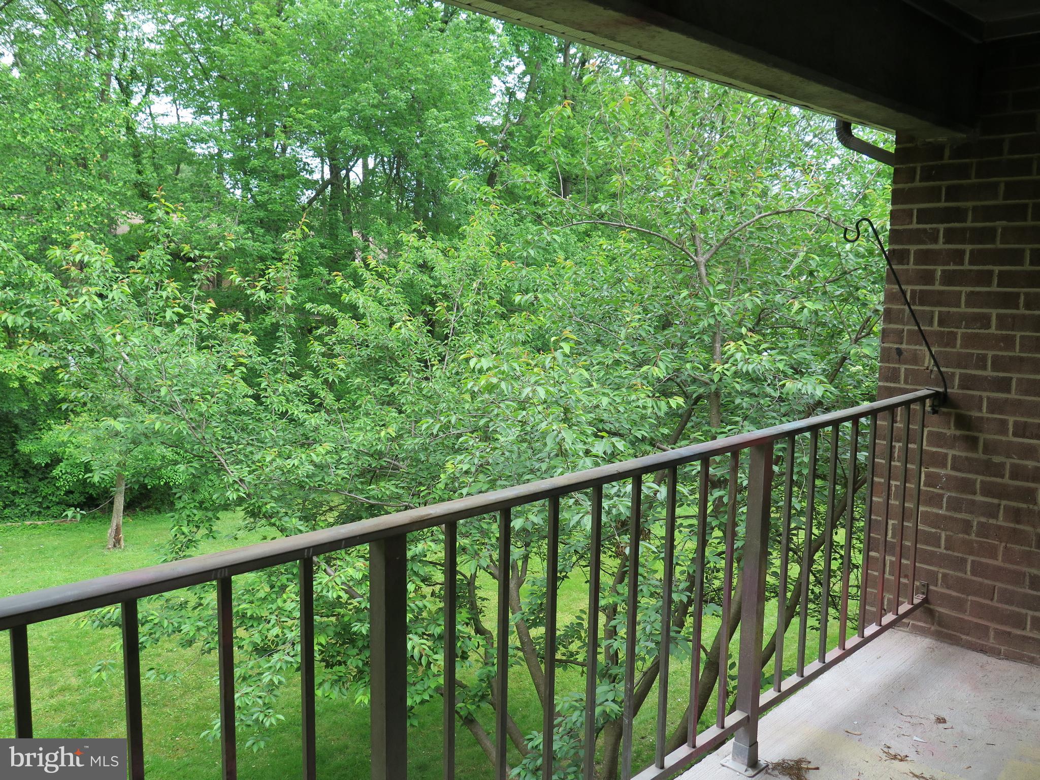 1424 Northgate Square, Unit 21B Reston, VA 20190 - Photo 2 of 28 Large deck overlooks trees & grassy common area