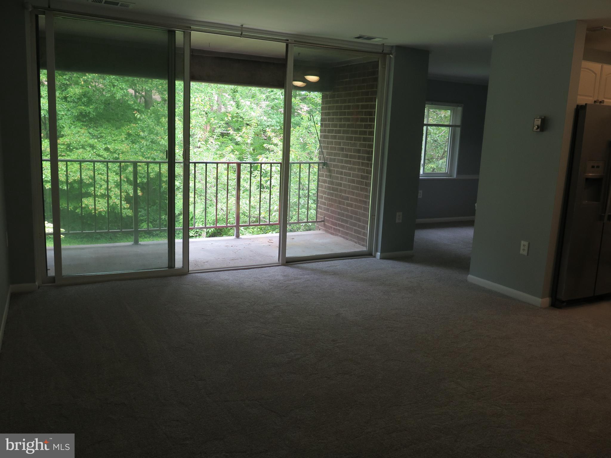 1424 Northgate Square, Unit 21B Reston, VA 20190 - Photo 19 of 28 View of Living Room to Deck next to Dining Room