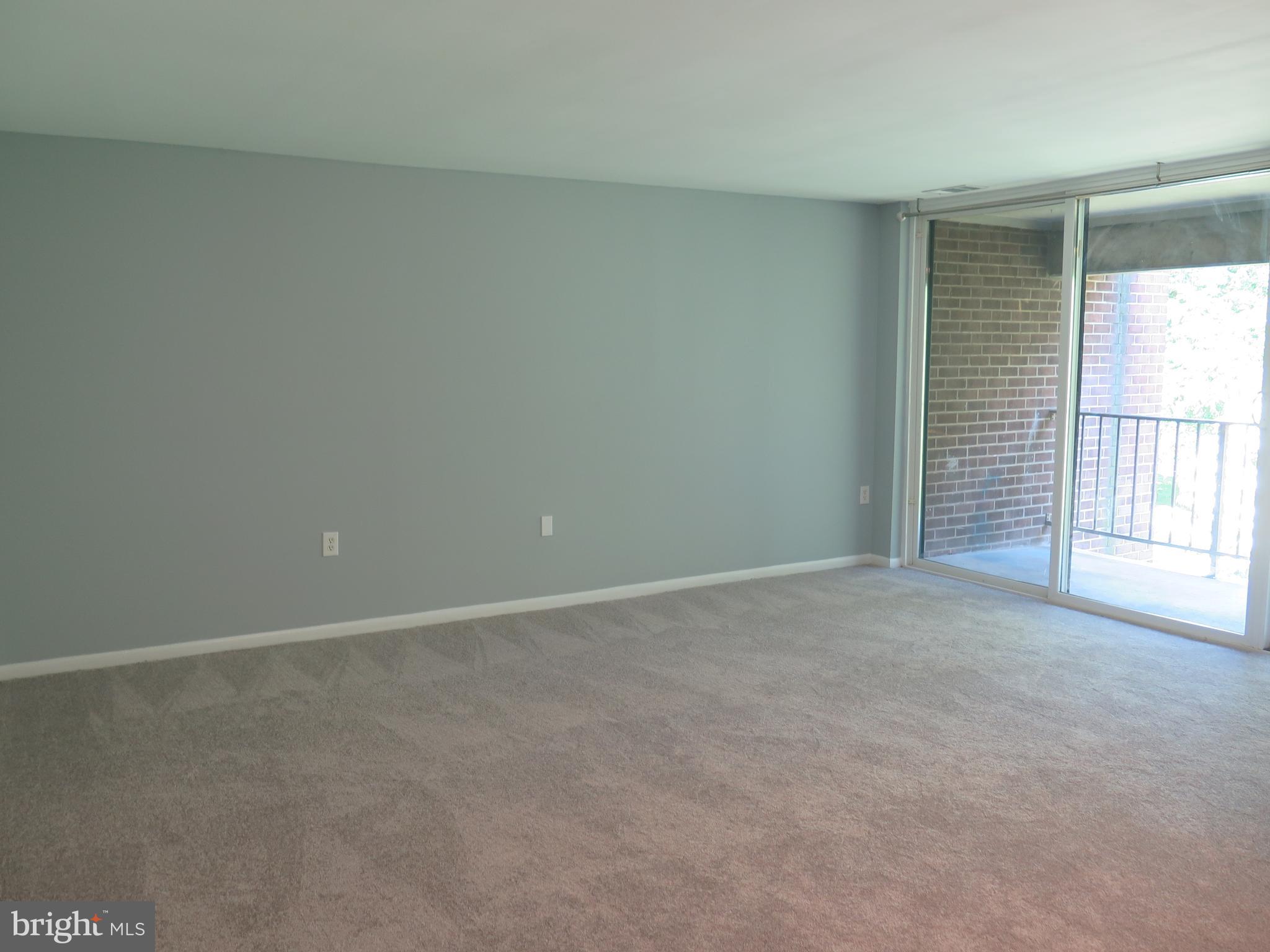 1424 Northgate Square, Unit 21B Reston, VA 20190 - Photo 3 of 28 Large Living Room with 3 panel SGD to deck