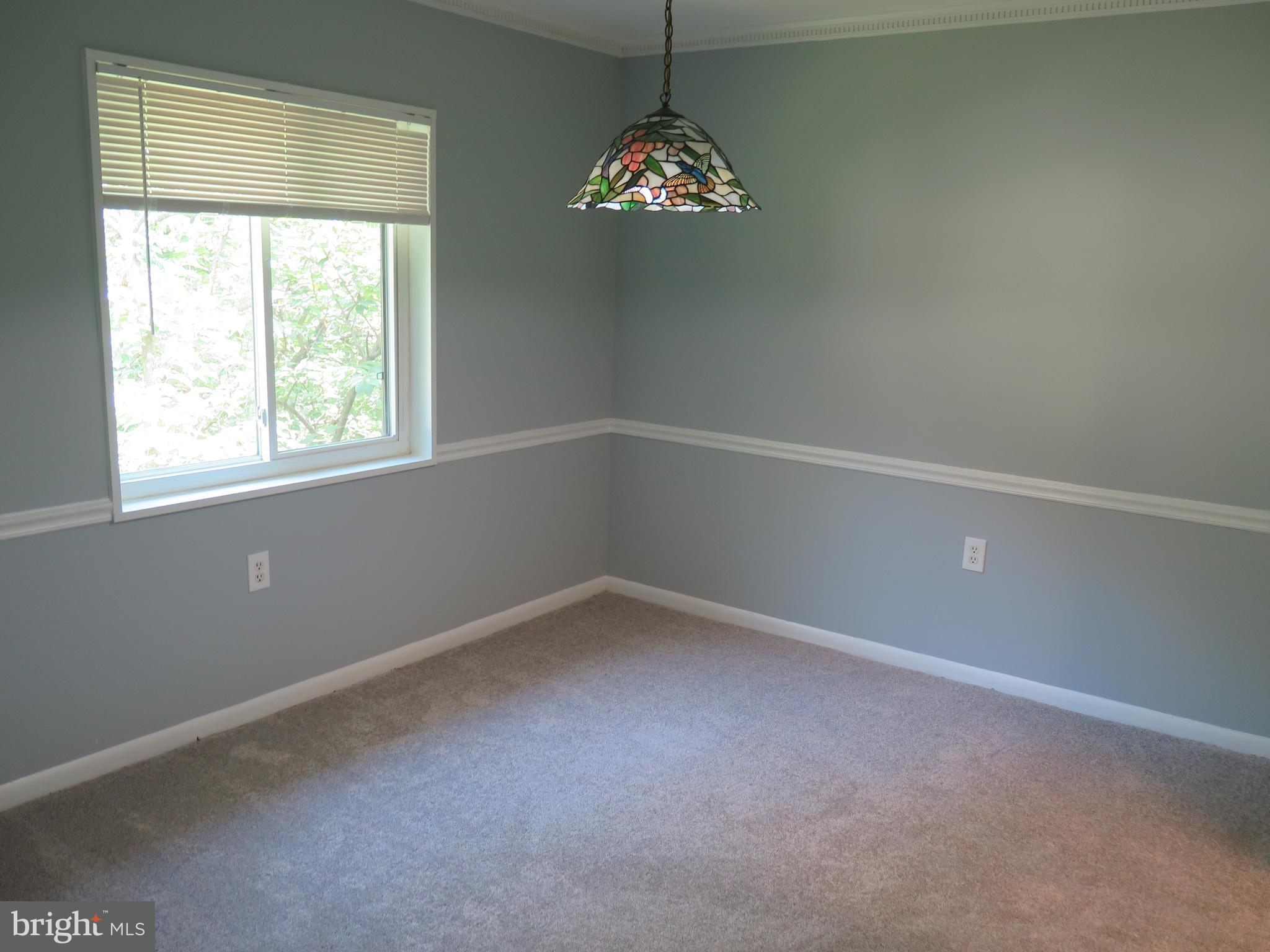 1424 Northgate Square, Unit 21B Reston, VA 20190 - Photo 5 of 28 Dining Room with chair rail overlooks common area