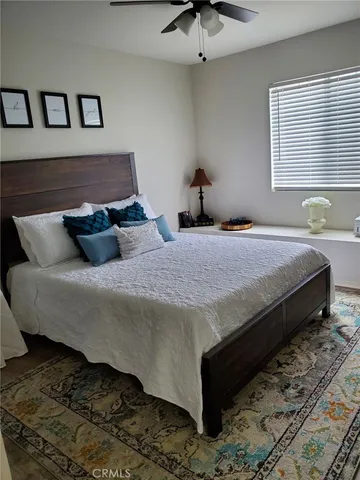 a bedroom with bed and window