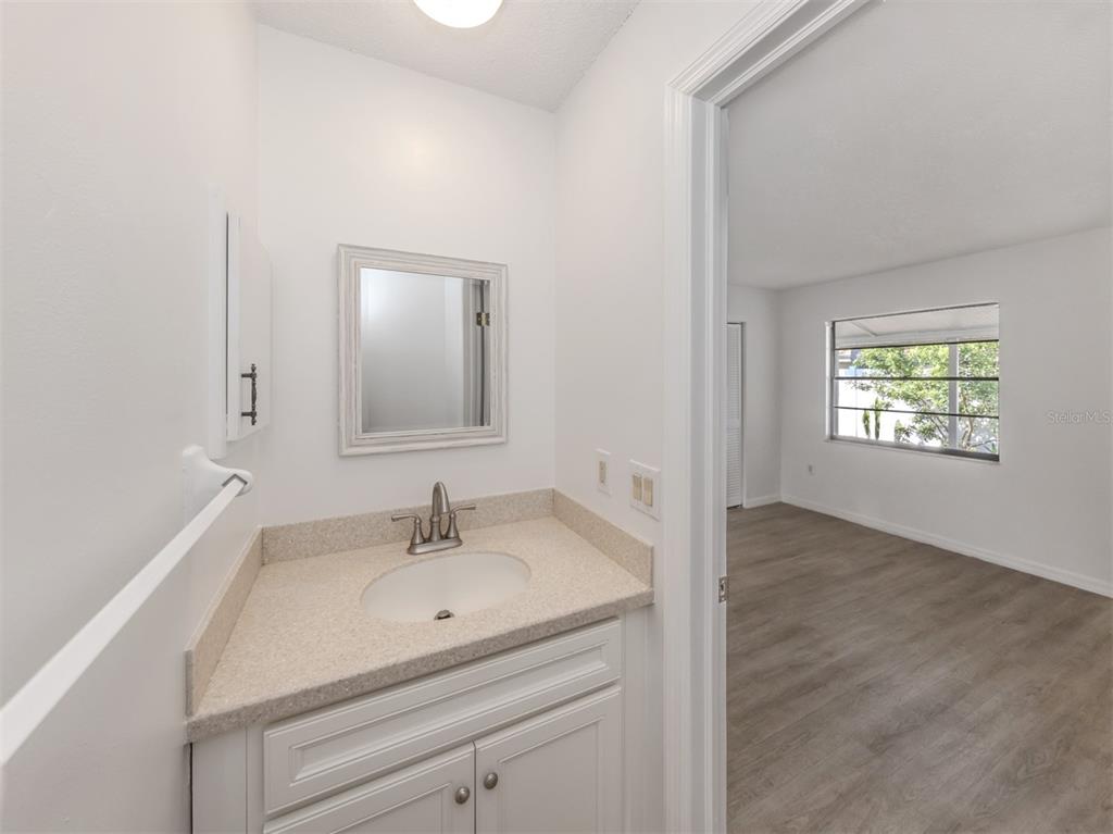 662 Substation Road Venice, FL 34285 - Photo 11 of 26 a bathroom with a sink and a mirror
