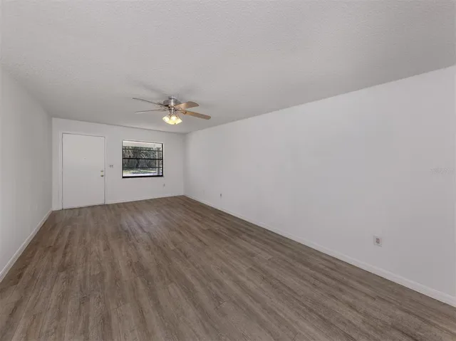 a view of an empty room and a window