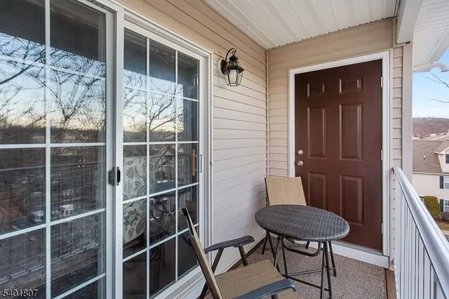 a view of a door and chair in the balcony