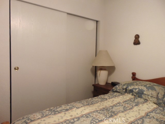 3835 Gardiner Ferry Road, Unit 62 Corning, CA 96021 - Photo 23 of 34 a bedroom with a bed and a window