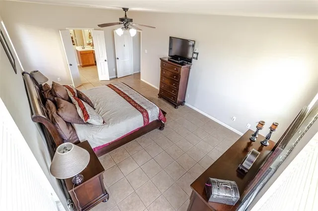a bedroom with a bed and cabinets