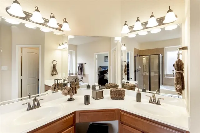 a bathroom with a sink double vanity and a mirror