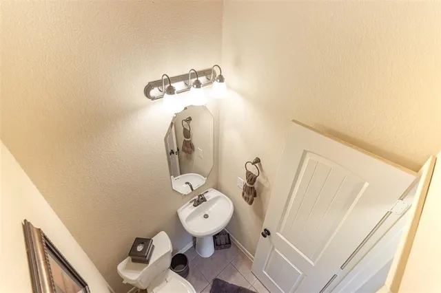 a bathroom with a sink and toilet