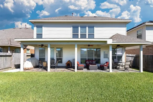 a view of a living room and kitchen with a large window