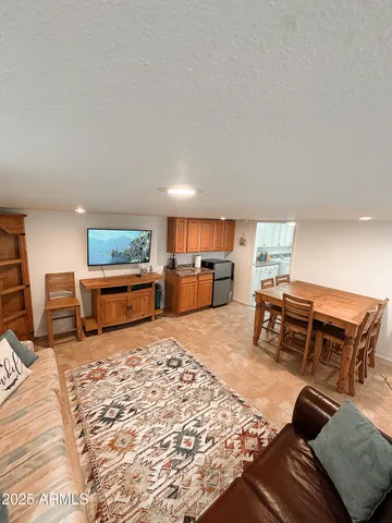 a bedroom with a bed window and couch