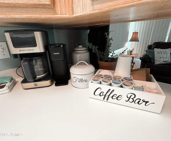 a living room with a couch and a chandelier