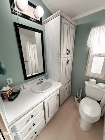 a bathroom with a sink and a window