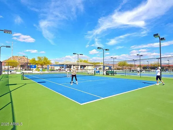 a view of an outdoor space and basketball court
