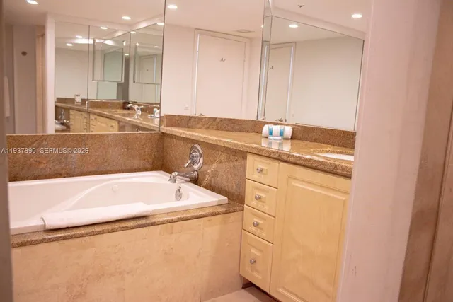 a bathroom with a bathtub and a sink