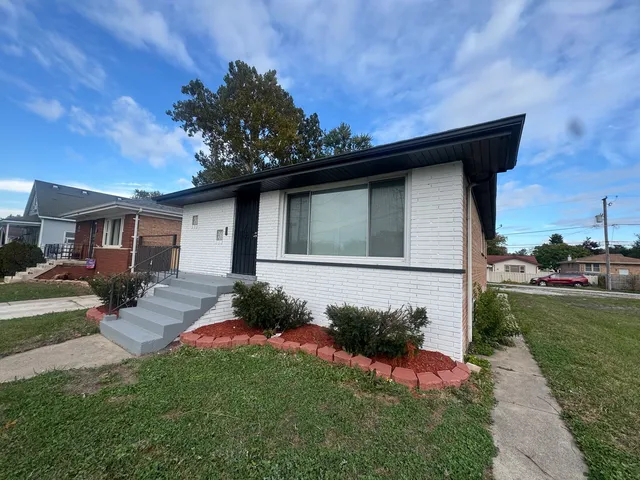 a backyard of a house with seating space