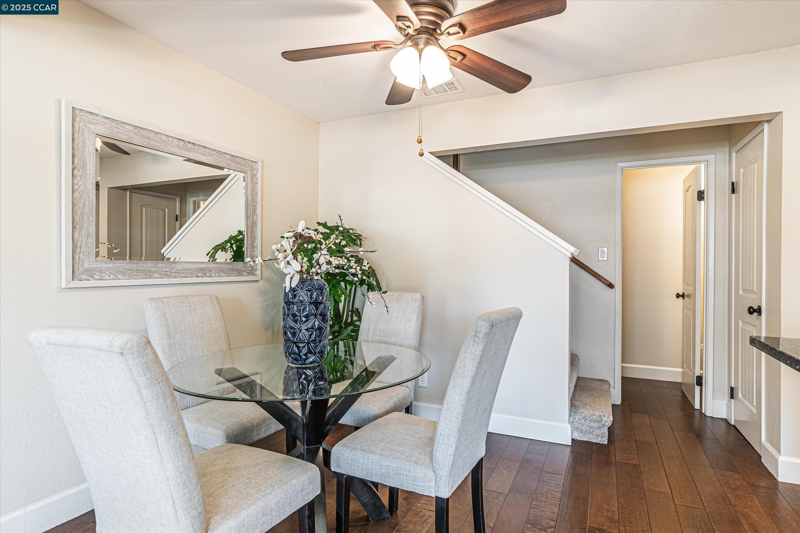 5055 Valley Crest Drive, Unit 196 Concord, CA 94521 - Photo 13 of 36 a view of a dining room with furniture and wooden floor