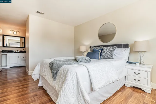 a bedroom with a bed and a dresser