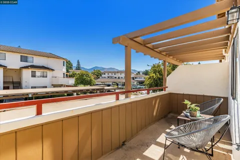 a view of an swimming pool with an outdoor space and seating area