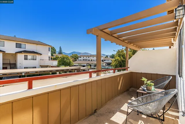 a view of an swimming pool with an outdoor space and seating area