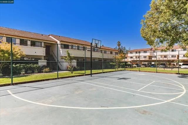 a view of a swimming pool with an outdoor seating