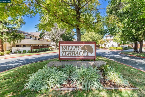 a sign on a pole on a street