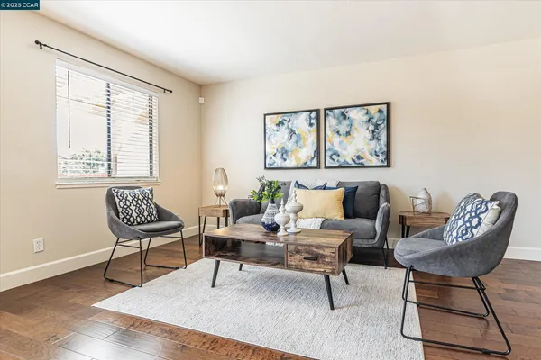 a living room with furniture and a window