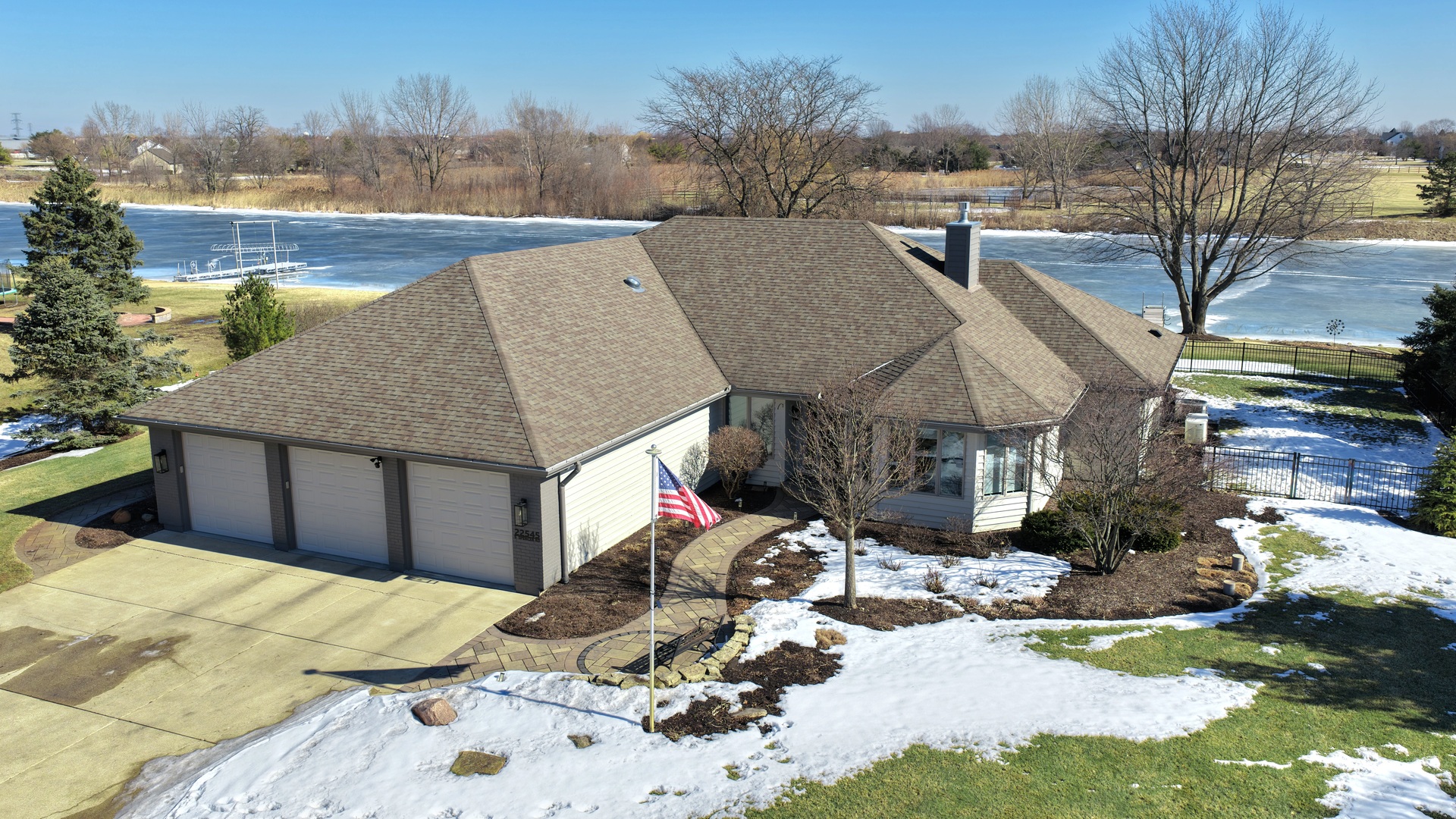 a view of a house with a snow in the yard