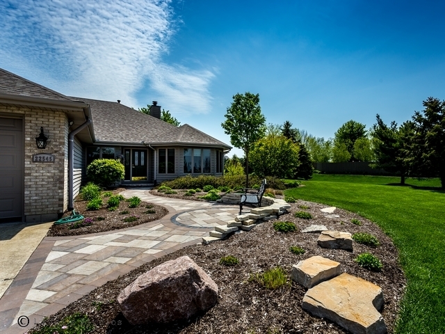 22545 South Spencer Road New Lenox, IL 60451 - Photo 41 of 47 a front view of a house with garden