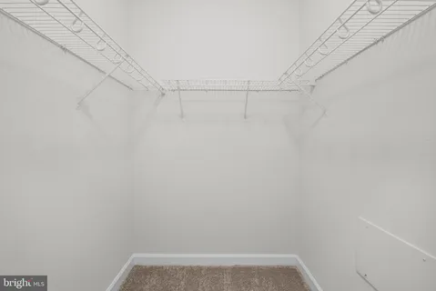 a bathroom with a sink a toilet and shower curtain