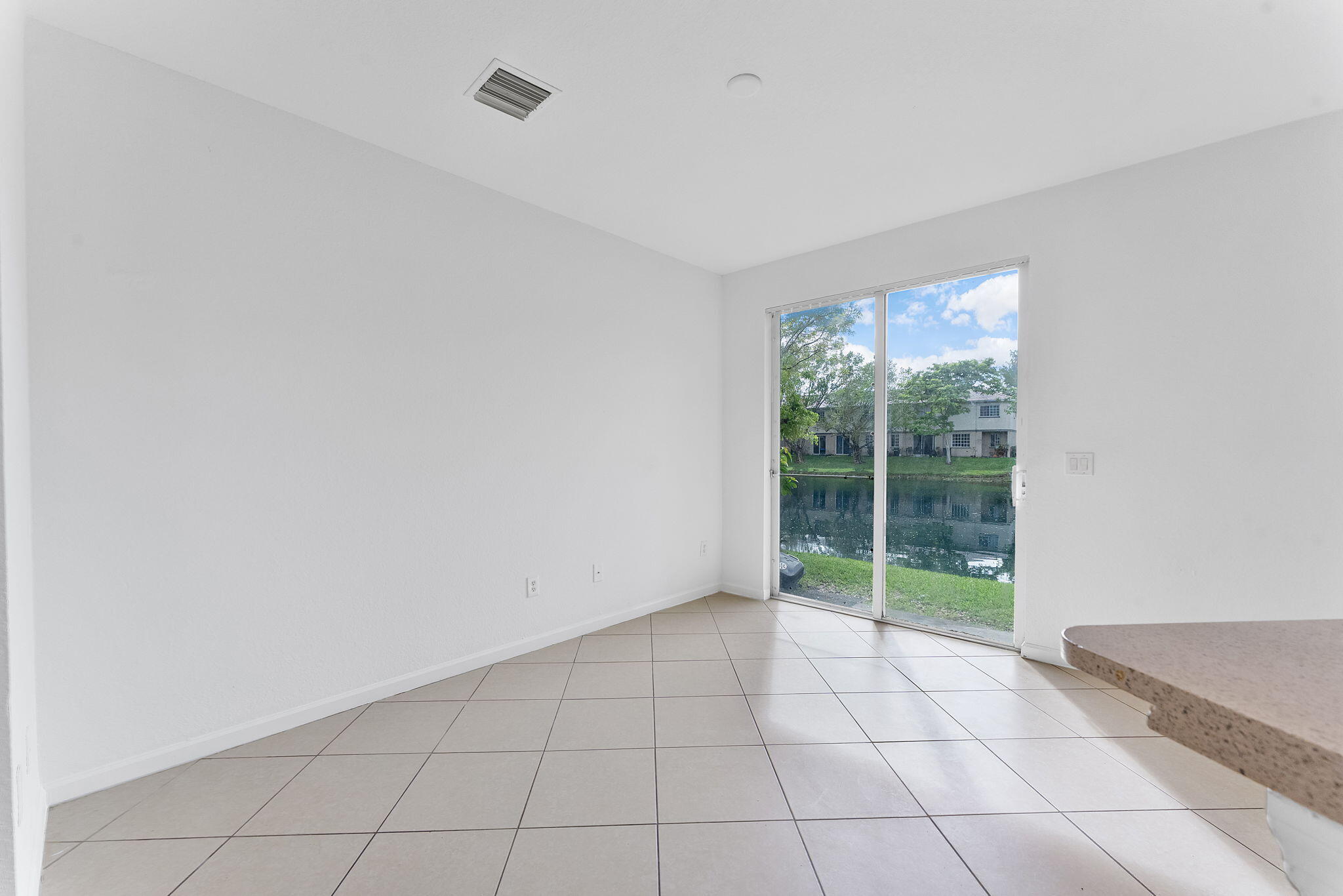 995 Abaco Lane Riviera Beach, FL 33404 - Photo 3 of 34 a view of an empty room with windows